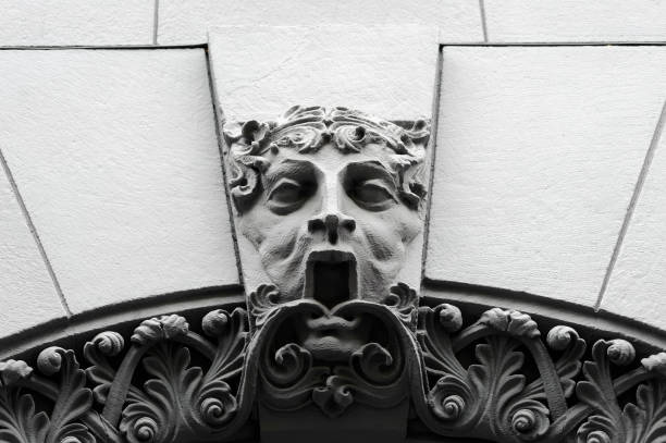Mascaron with open mouth on old building facade in Kyiv Ukraine stock photo