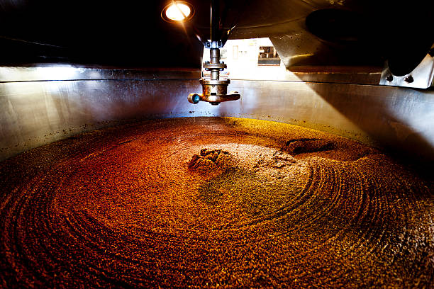Mash tun and dissolving vat Wooden mash tun and dissolving vats producing beer in a traditional Dorset brewery brewery stock pictures, royalty-free photos & images