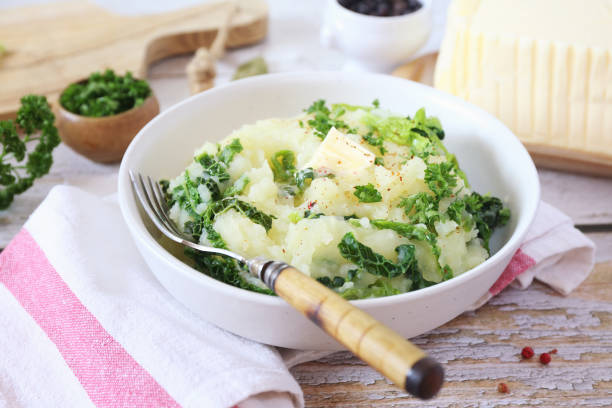 Mashed potatoes with fried savoy cabbage, breton butter and parsley stock photo