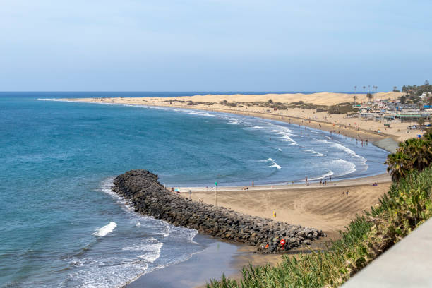 Maspalomas Beach (Playa de Maspalomas) in Gran Canaria, Canary Islands, Spain on a hot summer day. stock photo