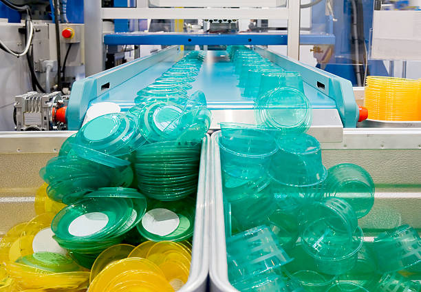 Mass production of plast  plastic container stock pictures, royalty-free photos & images