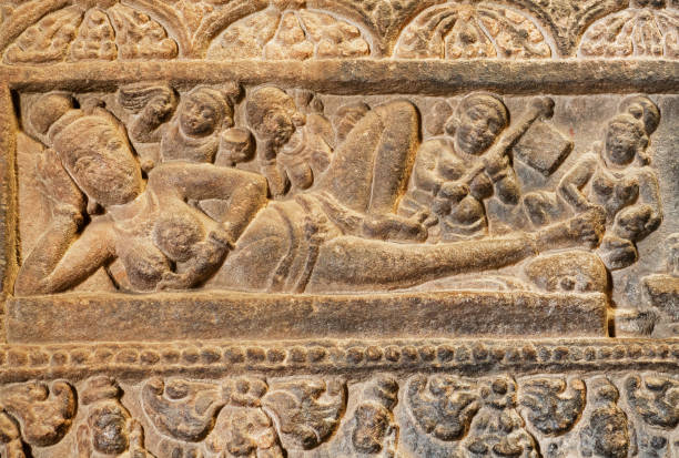 Massage for the Indian goddess on relief of 7th century temple in Pattadakal, India. UNESCO World Heritage site stock photo