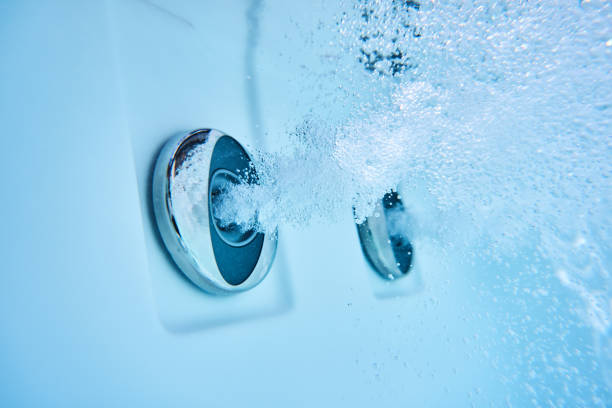 massage nozzles of whirlpool under water view water stream of massage jets in hot tub closeup hot tub stock pictures, royalty-free photos & images
