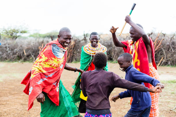 Massai family celebrating and dancing Massai family celebrating and dancing kenya stock pictures, royalty-free photos & images