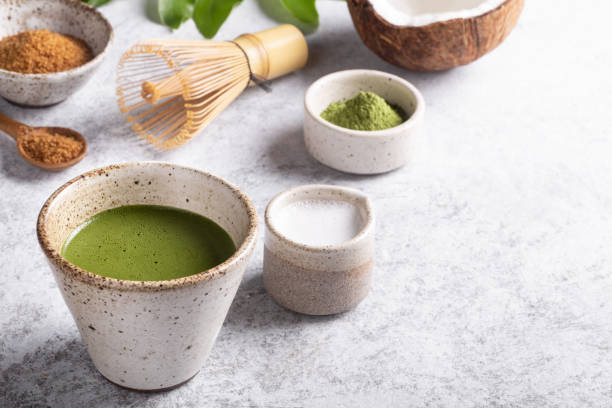 Matcha latte, Japanese green tea on white concrete background stock photo