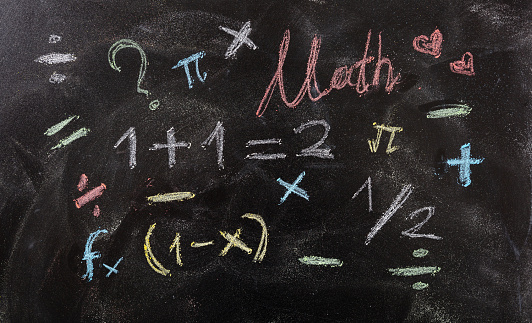 I love math concept. Math equations and symbols isolated, on blackboard background.