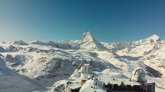 The Matterhorn is a mountain of the Alps, straddling the main watershed and border between Switzerland and Italy. It is a large, near-symmetric pyramidal peak in the extended Monte Rosa area of the Pennine Alps, whose summit is 4,478 metres high, making it one of the highest summits in the Alps and Europe