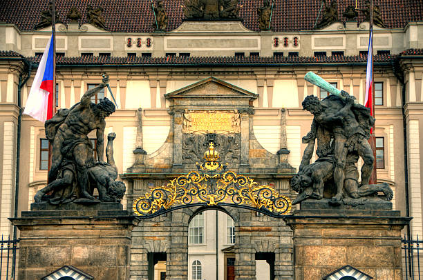 Matthias gate, Entrance of Prague Palace Matthias gate on Prague castle. The most early baroque work in Czech. Giant fighting statutes on top Mathias' Gate at Prague Castle's main gate. hradcany castle stock pictures, royalty-free photos & images