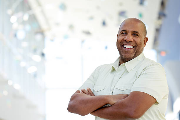 Mature African American man Mature African American smiling and looking at the camera. 50 54 years stock pictures, royalty-free photos & images