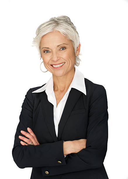 Mature business woman on white background. stock photo