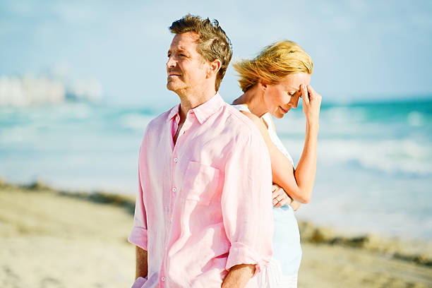 Mature Couple Having Difficult Relationship Mature Couple Having Difficult Relationship divorce beach stock pictures, royalty-free photos & images
