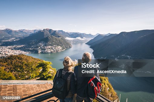 istock Mature couple hike above lake Lugano in the morning 1292251389