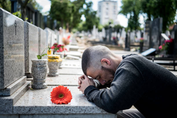 mature man is feeling sad because of losing closest person- covid-19 - covid cemiterio imagens e fotografias de stock