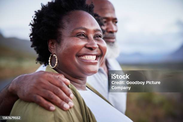 Mature woman smiling with her husband during a day in the countryside