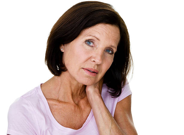Mature woman with aches and pains stock photo