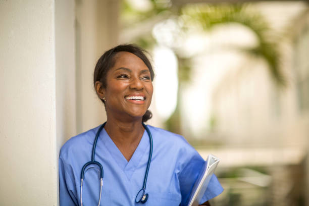 Mature woman working as a health care provider. stock photo