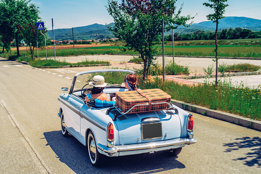 Mature Women on a Road Trip With Old-fashioned Convertible.