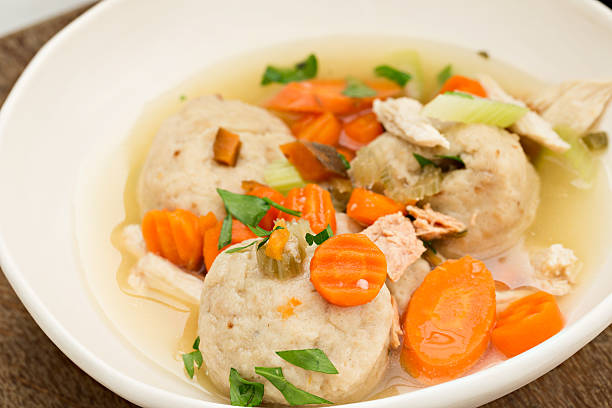 Matzo Ball Soup A high angle close up shot of a bowl of matzo ball soup. chicken dumplings stock pictures, royalty-free photos & images