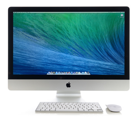 İstanbul, Turkey - July 22, 2014 : Apple iMac 27 inch desktop computer on white background. iMac displaying OSX Mavericks home screen. Mavericks is the latest operating system for Apple computers, made by Apple. iMac produced by Apple Inc.