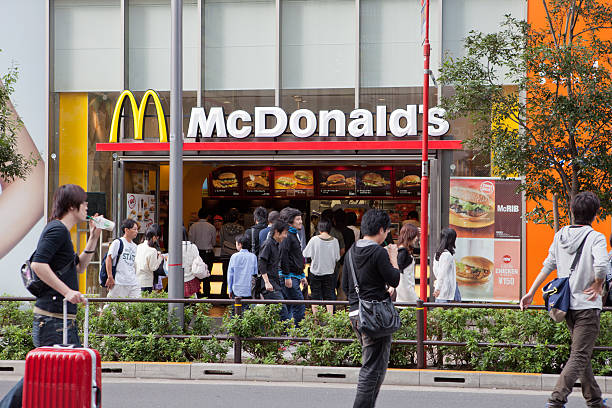 McDonald's restaurant in Japan Tokyo, Japan - October 1, 2011 : Pedestrians walk past a McDonald\'s restaurant in Akihabara, Tokyo, Japan. Some customers buy food at a McDonalds restaurant. mcdonalds japan stock pictures, royalty-free photos & images