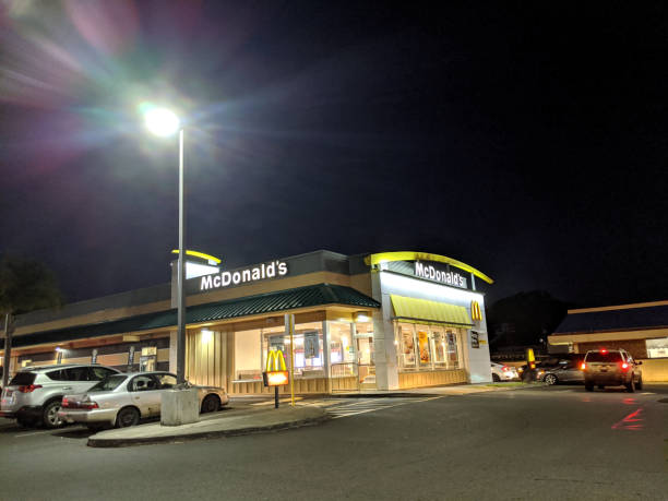 McDonalds Store and drive thru at night stock photo