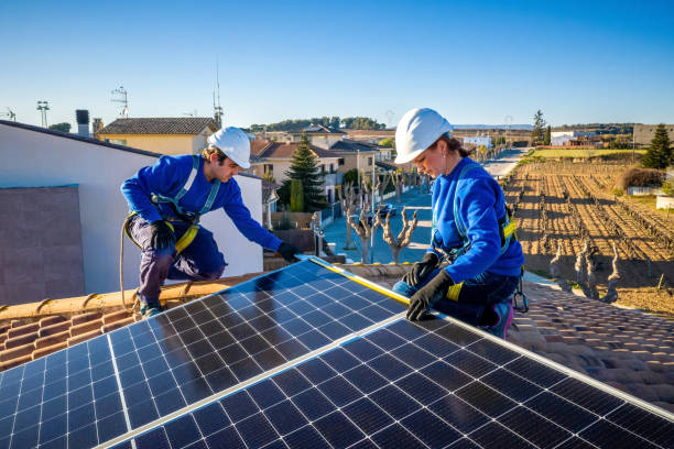 measuring solar panels installation on a roof stock photo