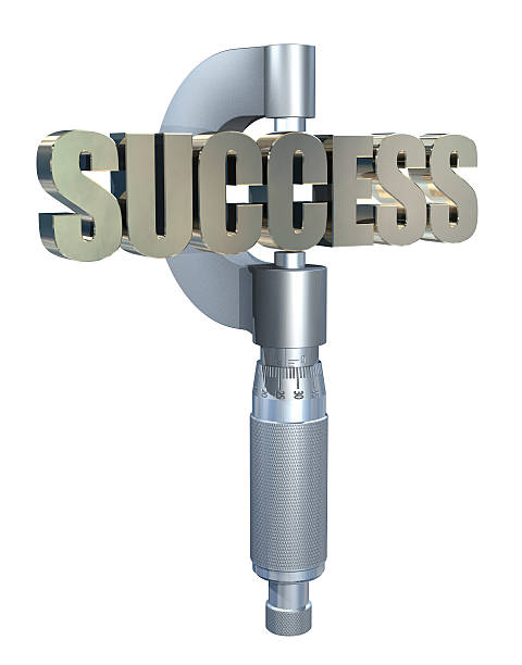 Measuring success with micrometer stock photo