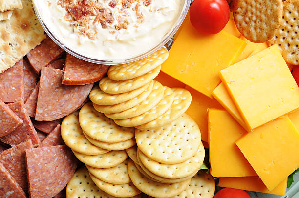 Meat, Cheese & Crackers Tray A delicious fresh meat, cheese and crackers tray with dip. cracker snack photos stock pictures, royalty-free photos & images