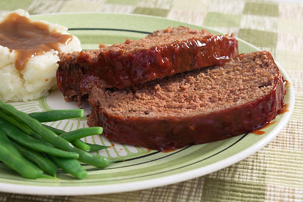 meat loaf for supper - meatloaf stockfoto's en -beelden