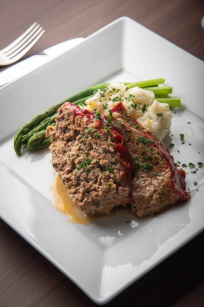 meat loaf with mashed potato and asparagus meat loaf with mashed potato and asparagus meatloaf stock pictures, royalty-free photos & images