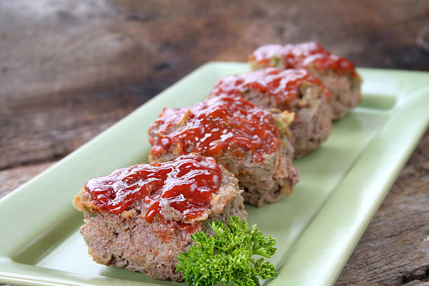 MeatLoaf Mini Meat loaf's on a tray with parsley. meatloaf stock pictures, royalty-free photos & images