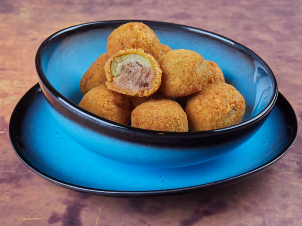 Meat-stuffed, breaded and fried olives Ascolana Olives stock photo