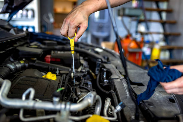 mechanic-checking-oil