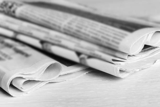 Media news concept, stack of newspapers on the desktop. Selective focus, blur. stock photo