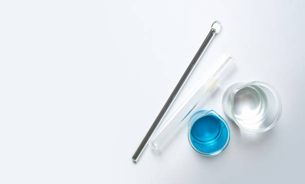 Medical chemicals ingredient on white laboratory table. Methylthioninium chloride, alcohol, stirring rod and test tube. Top view stock photo