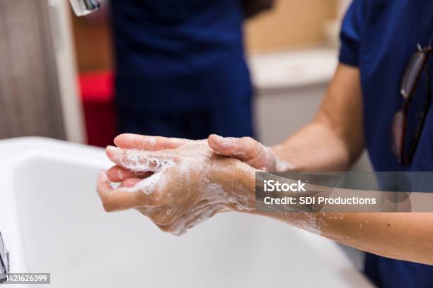 Medical personnel washing hands
