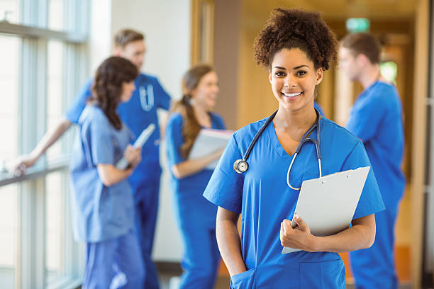 Medical student smiling at the camera Medical student smiling at the camera at the university nursing school stock pictures, royalty-free photos & images