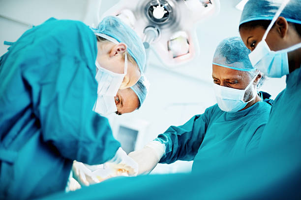 Medical team performing surgery stock photo