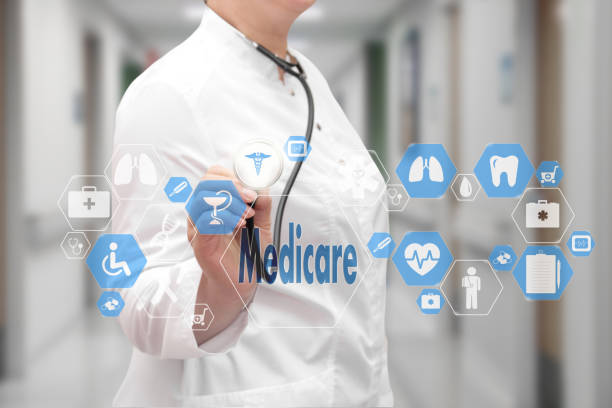 Medicare. Medical Doctor with stethoscope and Medicare icon in Medical network connection on the virtual screen on hospital background. Technology and medicine concept. stock photo