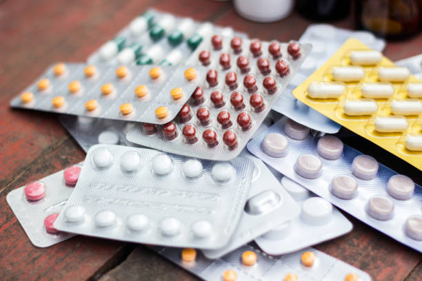 Medicines on wooden table stock photo