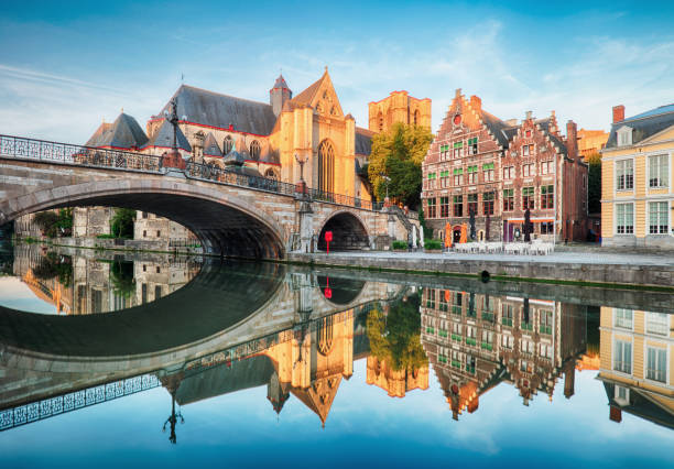 Medieval cathedral and bridge over a canal in Ghent - Gent, Belgium, Sint - Michielskerk stock photo
