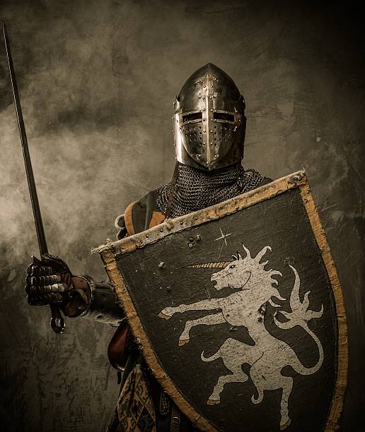 Medieval knight in full armor ready for battle stock photo