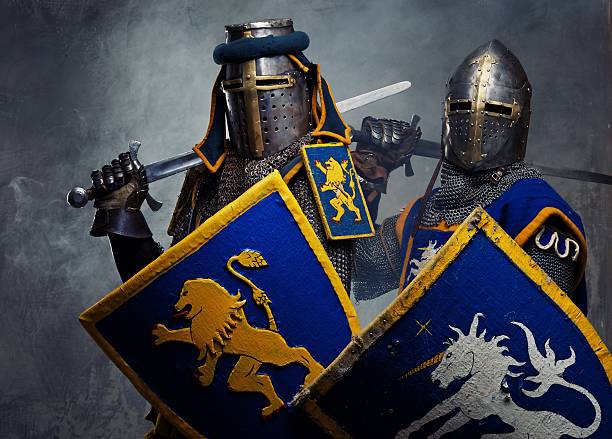 Medieval knights on grey background. stock photo