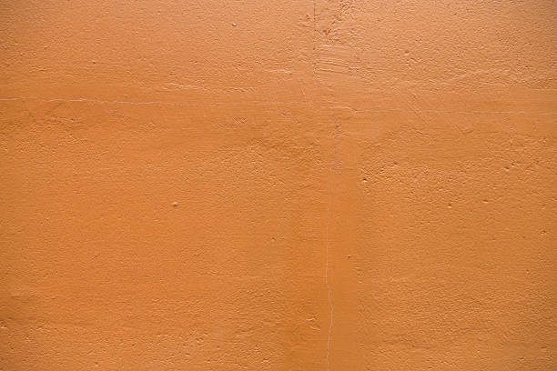 Mediterranean Earth Tone Typicall Mediterranean clay plaster surface, adobe sandy texture with tiny hair cracks adobe backgrounds stock pictures, royalty-free photos & images