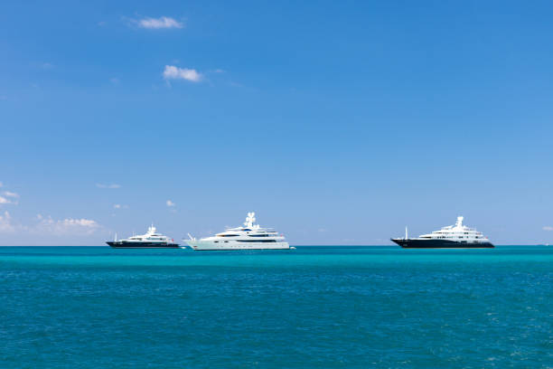 Mega Yachts anchored against the horizon stock photo