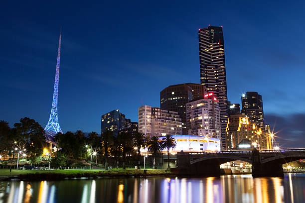 Melbourne City Skyline & Arts Precinct Melbourne city skyline and arts centre precinct at dusk with Yarra River in the foreground. St Kilda Road runs over the Princes Bridge in the foreground and the Southbank and arts centre precinct are in the background with the iconic spire of the State Theatre on the left and Hamer Hall on the right. arts centre melbourne stock pictures, royalty-free photos & images