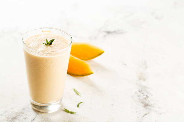 Melon smoothie Melon smoothie with yogurt orange smoothie stock pictures, royalty-free photos & images