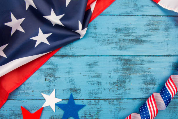 Memorial Day background. American flag and stars on blue wood. Space for your text Veterans Day background. American flag on blue wood. Space for your text memorial day background stock pictures, royalty-free photos & images