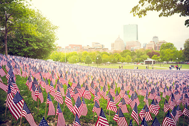 Memorial Day Lot of US flags in the park in Boston. memorial day stock pictures, royalty-free photos & images