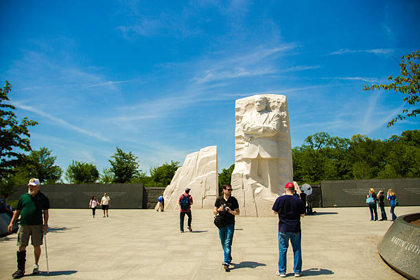Memorial to Dr. Martin Luther King in Washington DC Washington DC - May 2, 2013: Memorial to Dr. Martin Luther King. The memorial is America's 395th national park. On this spring day people gather to take photos of the monument and memorial to Martin Luther King. People admire the statue of Dr. King. The original civil rights march took place on August 28, 1963. The memorial attracts visitors from everywhere.  mlk memorial stock pictures, royalty-free photos & images